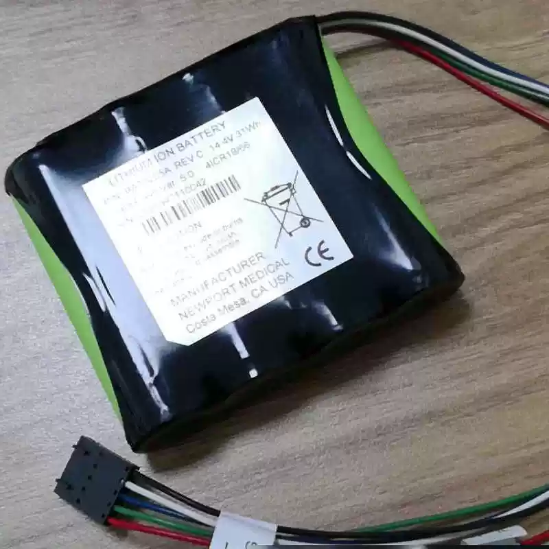 Representative wired Newport HT70 backup-battery photo; BAT3205A reference requires confirmation against actual shipping-lot label and harness